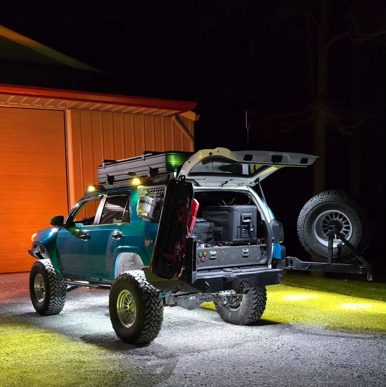 A 4Runner vehicle with hatch light pods installed, providing illumination during nighttime or low-light conditions.