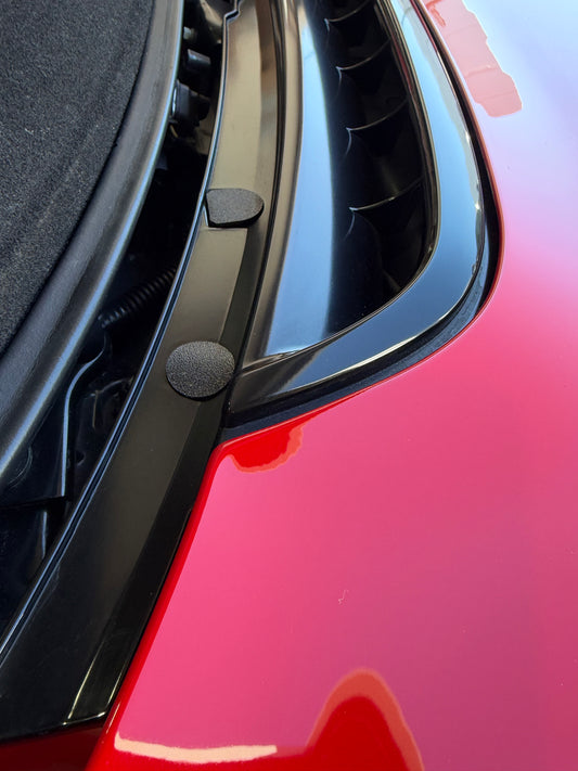 Obisan3D low-profile engine garnish mounting hole plugs installed on a red Acura NSX, showing the textured black finish and flush appearance.