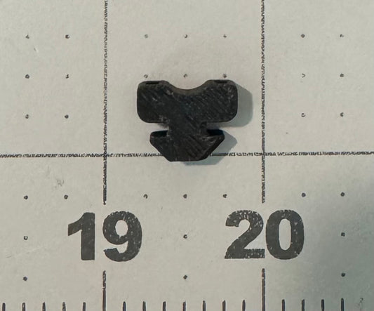 A 3D printed ziptie mount attached to a metal roof rack, used for organizing wiring.