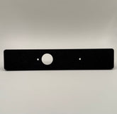 Black flat switch panel mount for LC250/Prado designed for Auxbeam, with a circular cutout in the center against a white background.