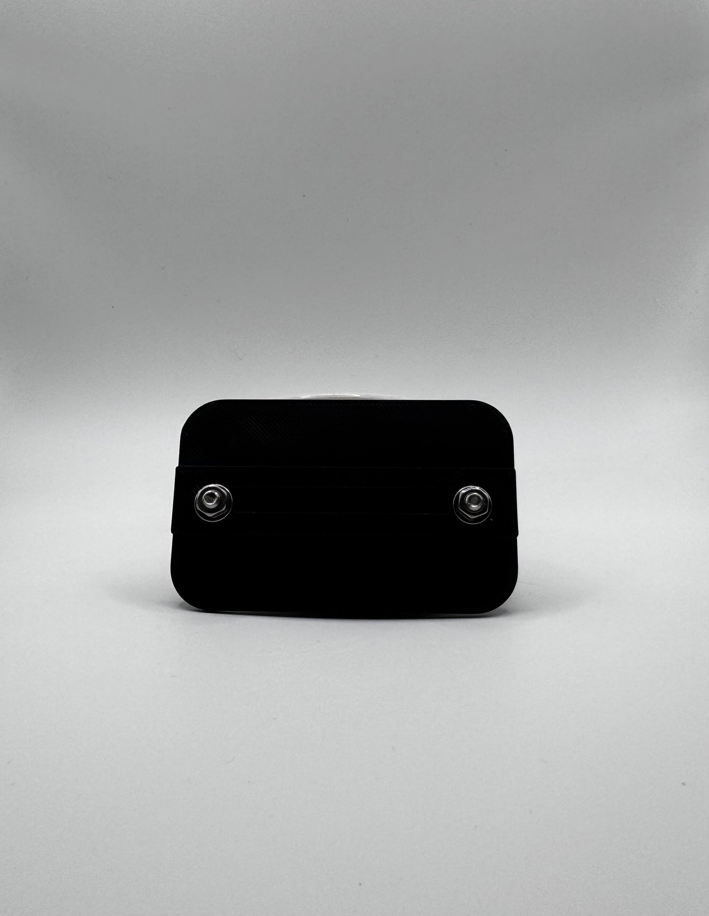 Black rectangular object on a gray background