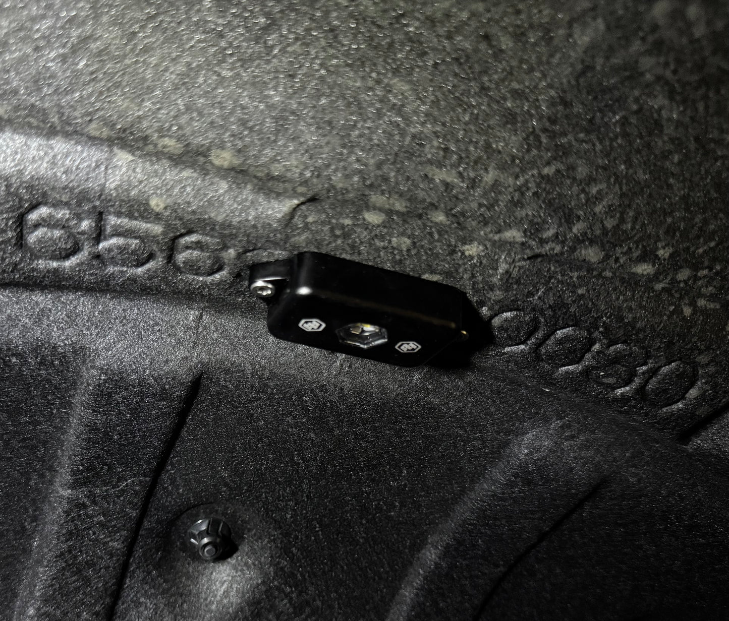 Close-up of a Baja Designs Rock light mounted on a Toyota Land Cruiser.