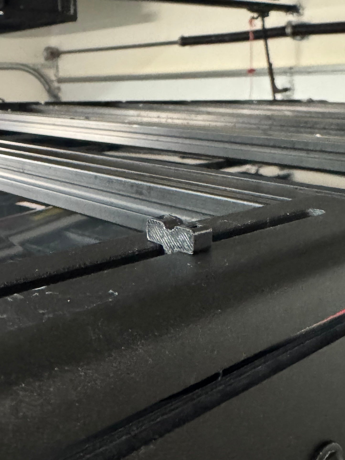 close up of Obisan3d Ziptie mount on a roof rack side panel.