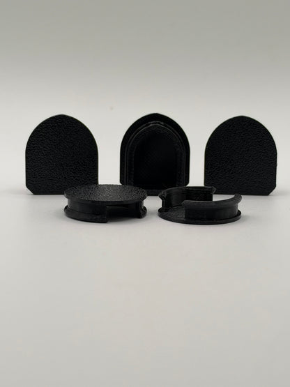 Five black 3D-printed Acura NSX engine garnish mounting hole covers showing their low-profile snap-in design