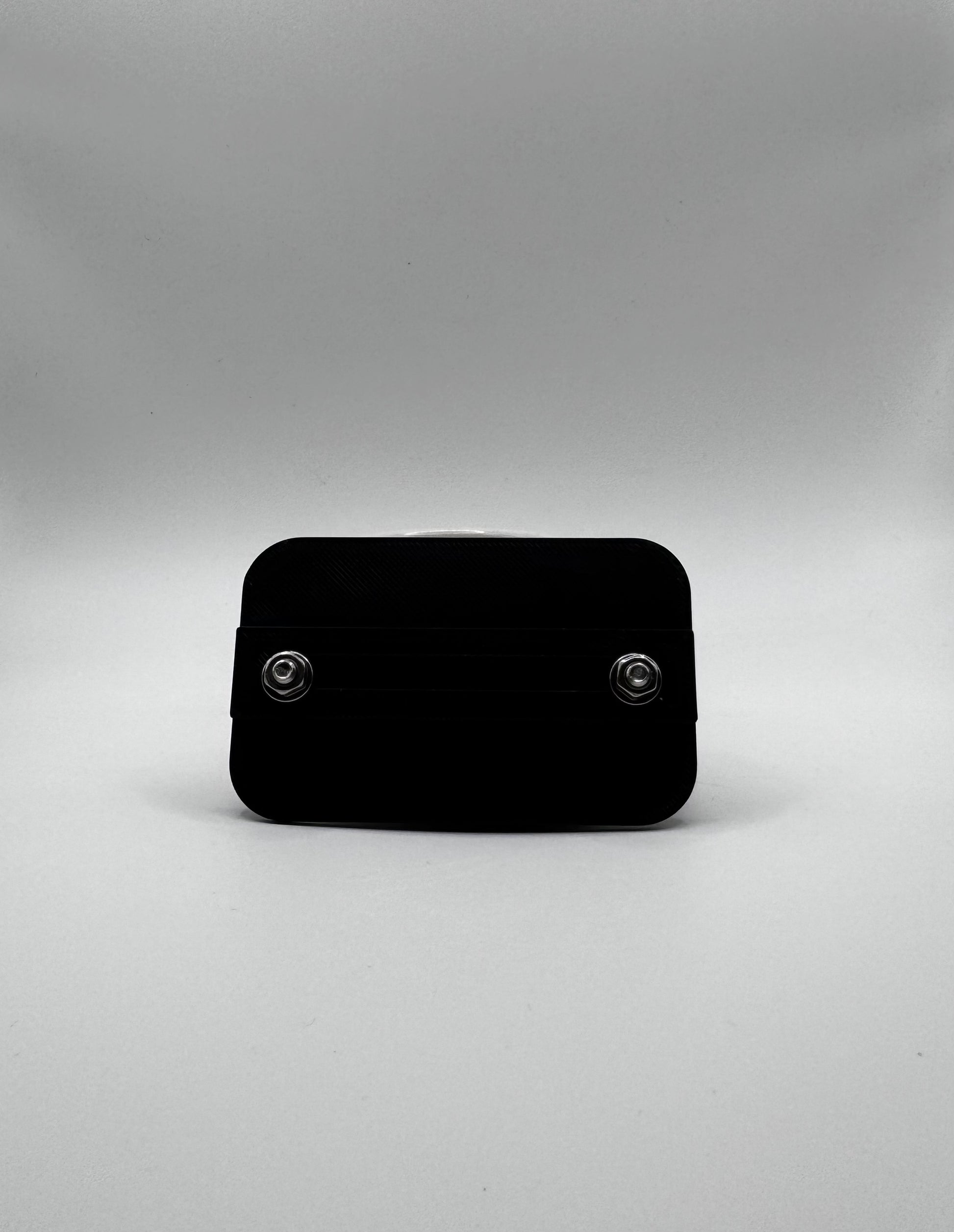 Black rectangular object on a gray background