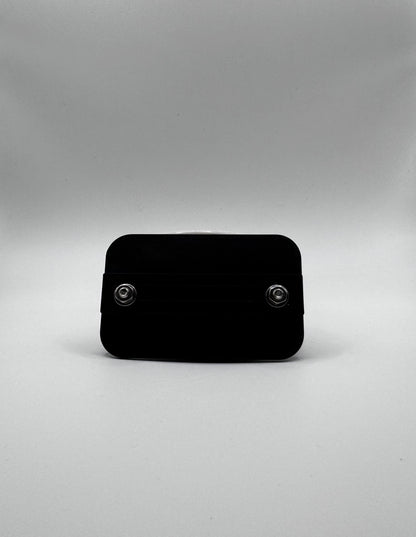 Black rectangular object on a gray background