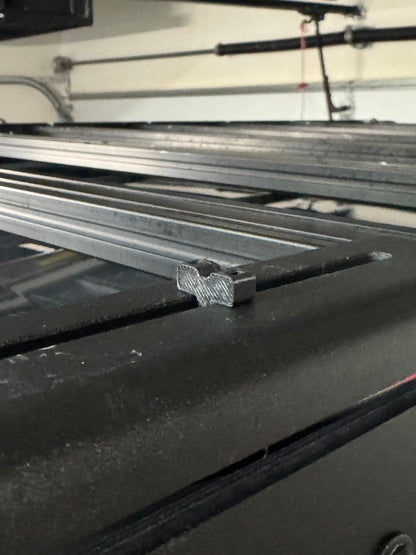 close up of Obisan3d Ziptie mount on a roof rack side panel.